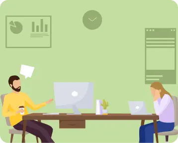 Two colleagues working at their desks in an office