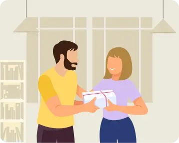 Colleagues exchanging a gift at the workplace